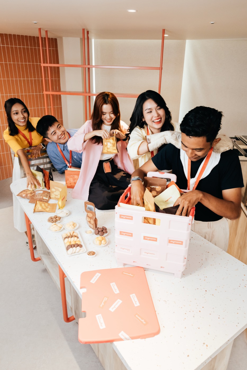 Team packing Joymom's cookie products