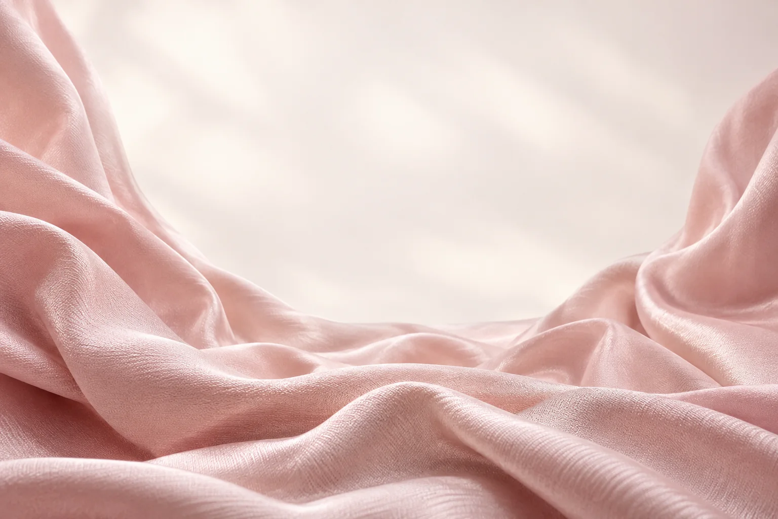 Flowing blush silk framing the Dolfi product